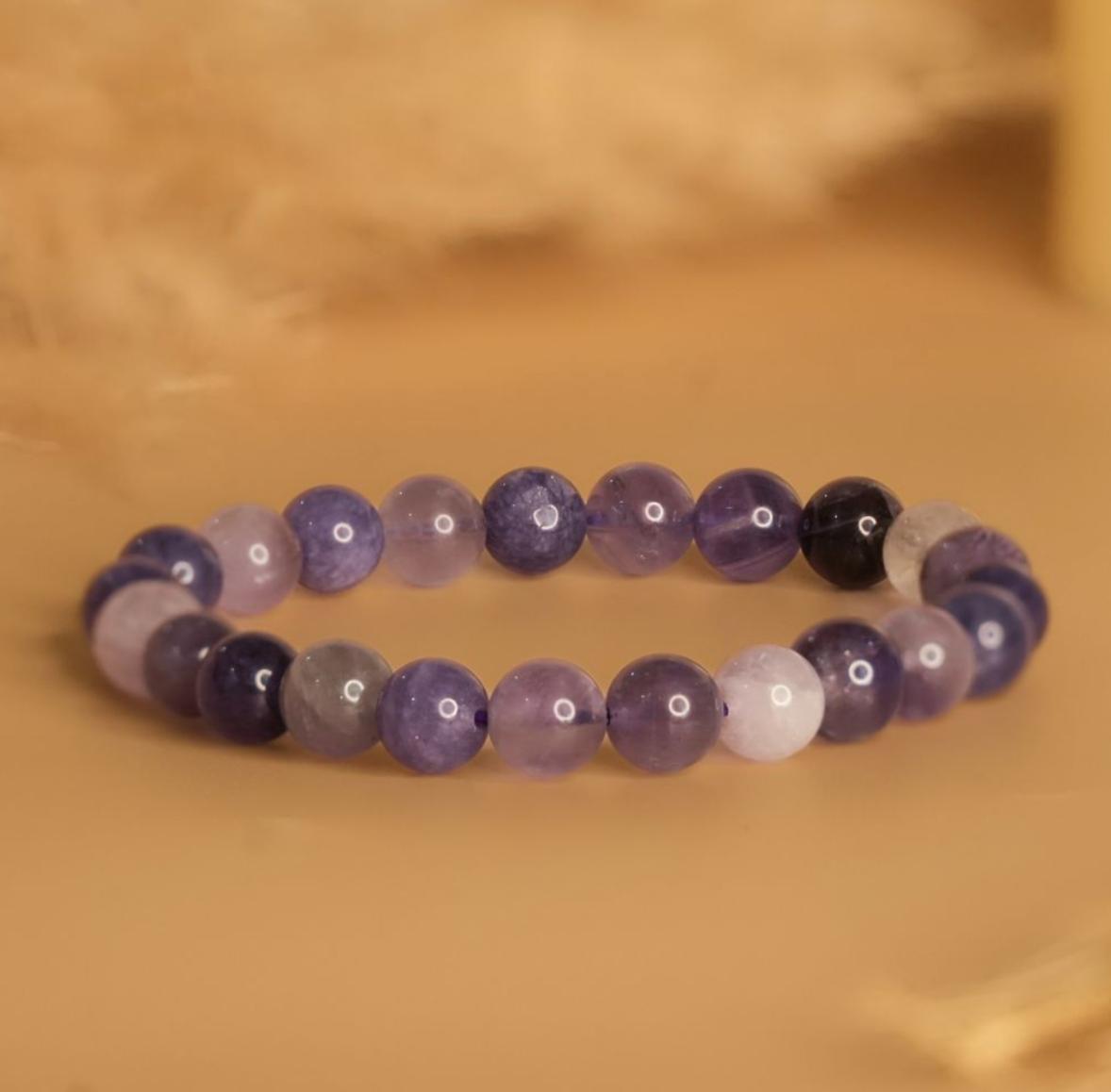 amethyst mystic bracelet on a beige background