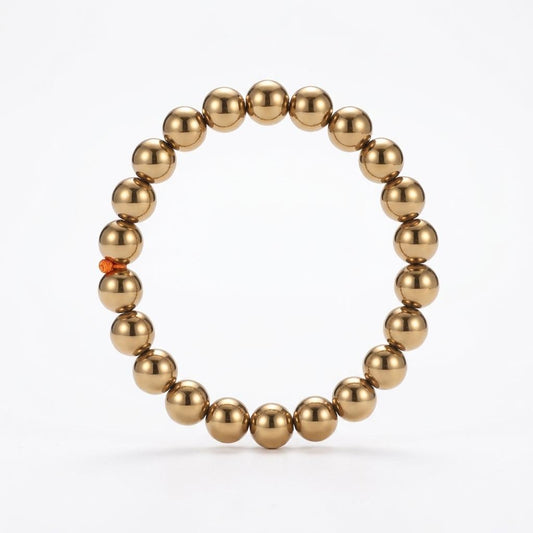 Golden hematite bracelet on a white background