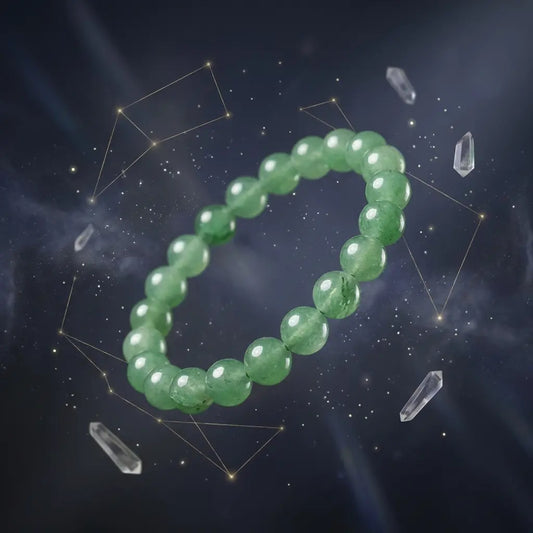 Green aventurine bracelet with crystals on a dark background