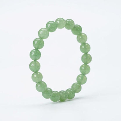 Green beaded bracelet on a white background